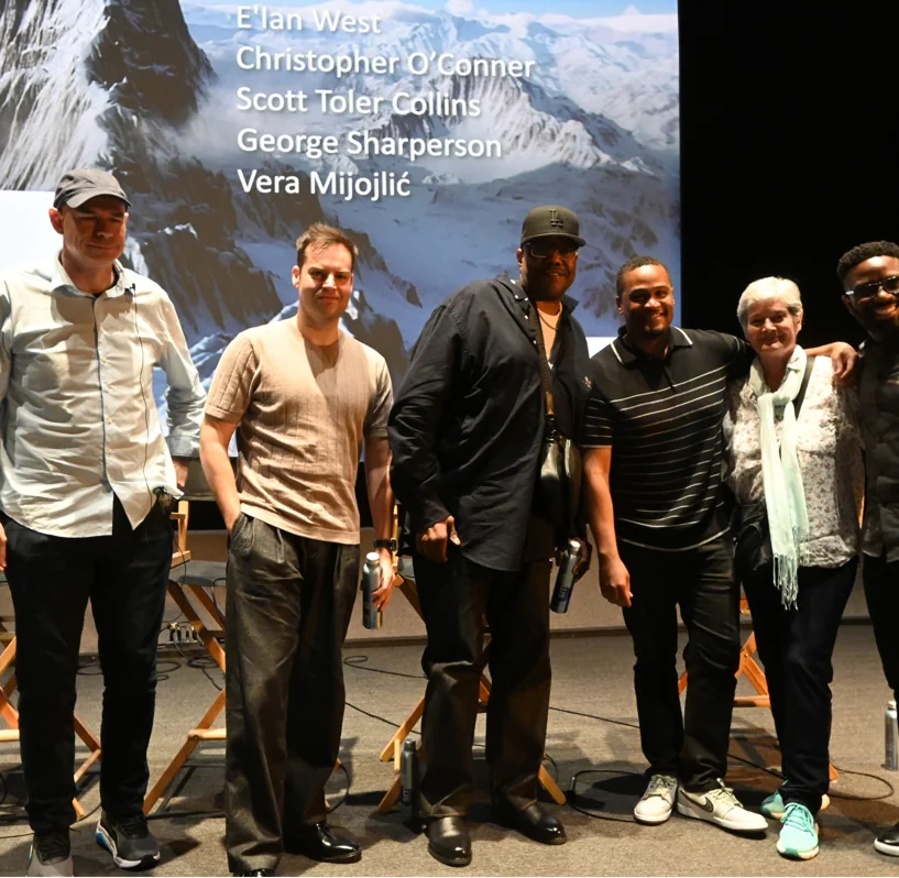 E'Ian West on stage with fellow filmmakers Christopher O'Conner, Scott Toler Collins, George Sharperson, and Vera Mijojlić at a panel discussion