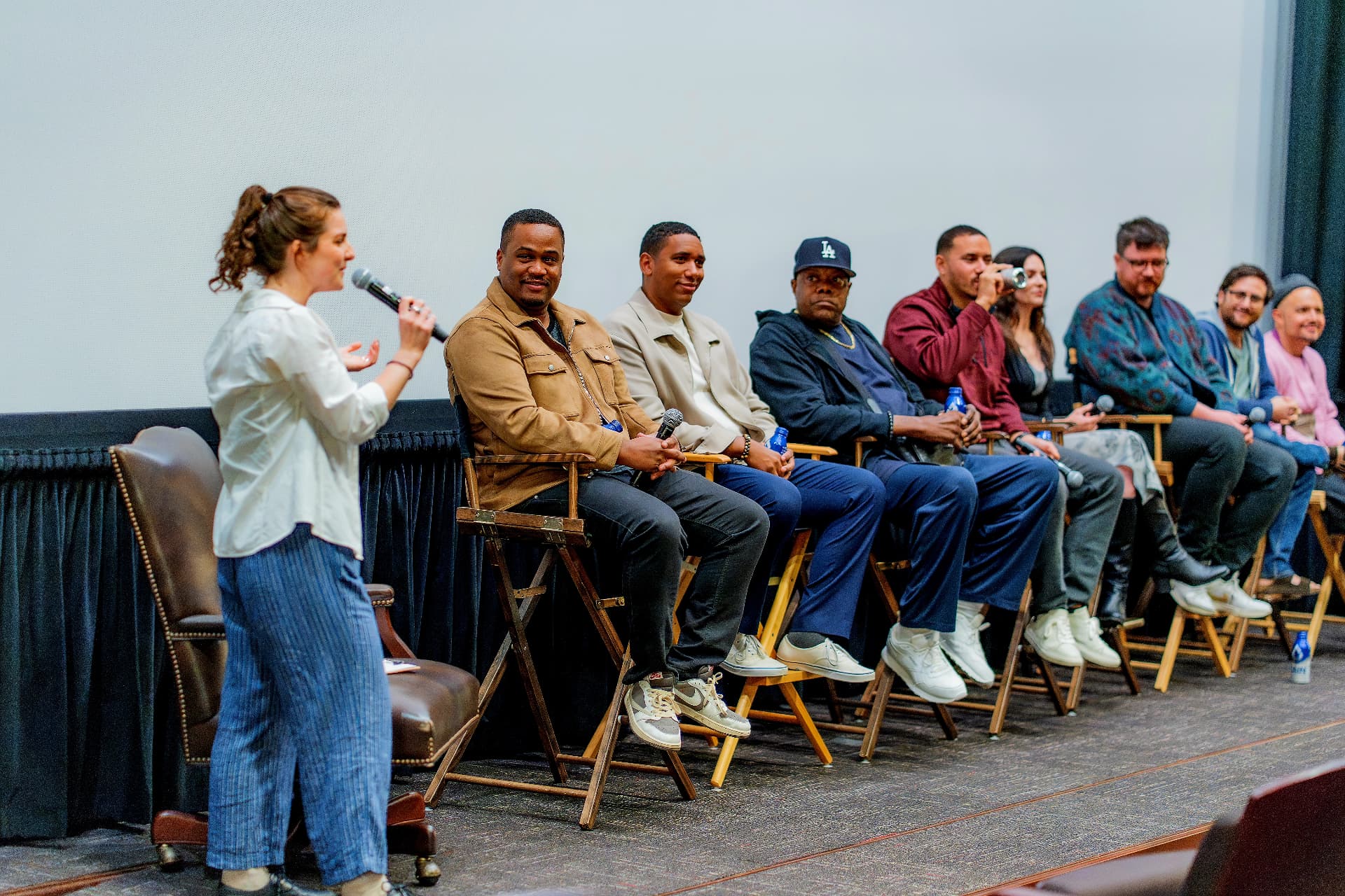 E'Ian West on stage with fellow filmmakers during a post screening panel Q and A