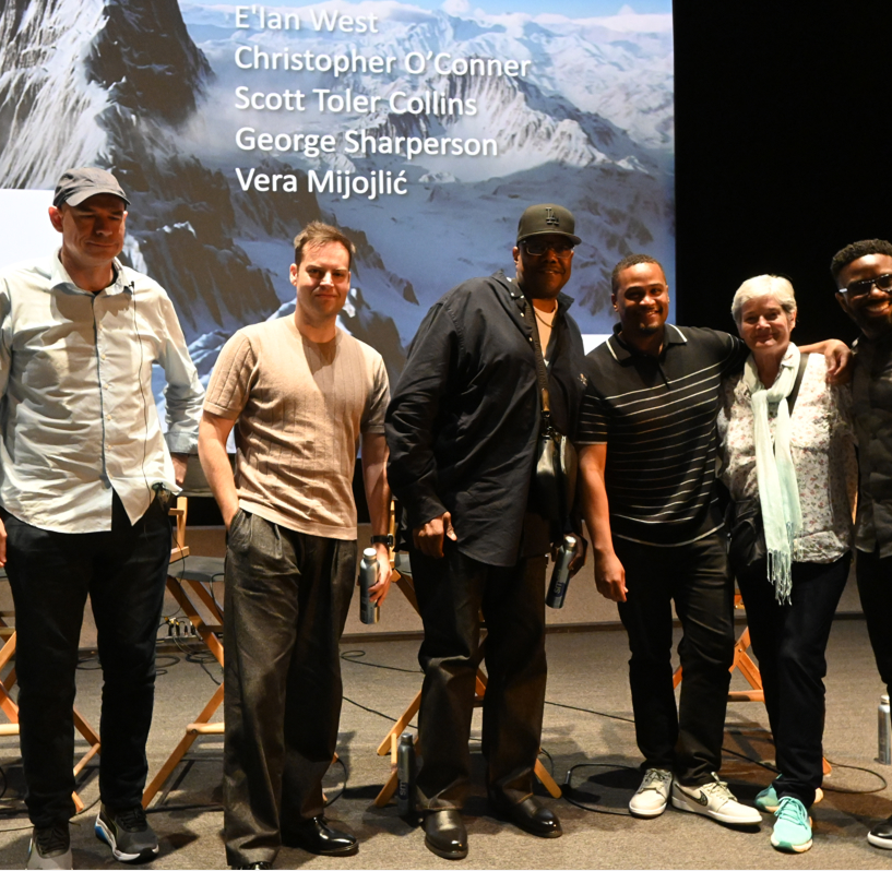 E'Ian West on stage with fellow filmmakers Christopher O'Conner, Scott Toler Collins, George Sharperson, and Vera Mijojlić at a panel discussion