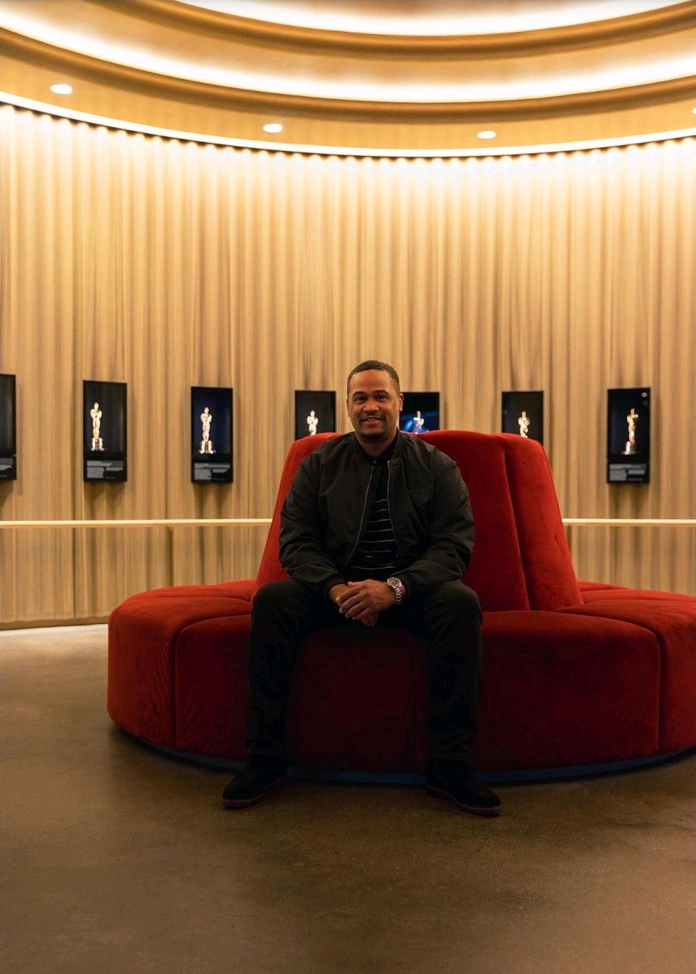 E'Ian West seated inside the Academy Museum Oscars lounge
