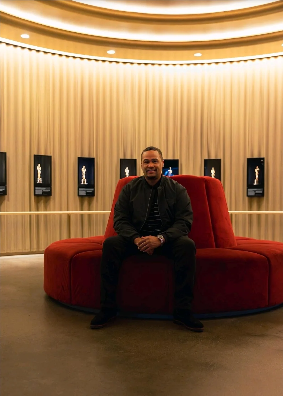 E'Ian West seated inside the Academy Museum Oscars lounge
